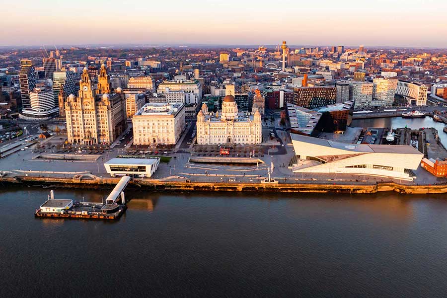 Aerial view looking towards the three graces and Museum in Liverpool at dusk