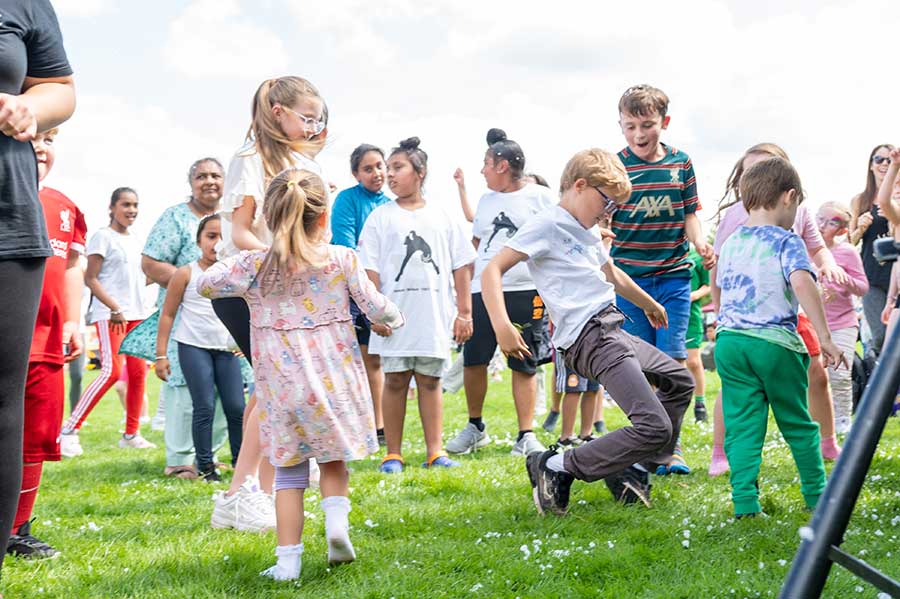 Group of children and families playing outside