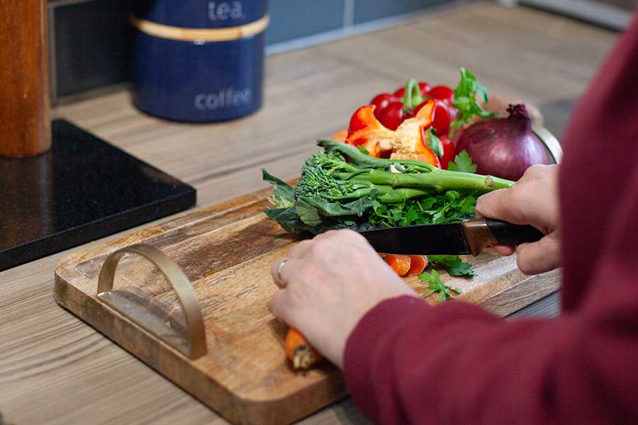 Person chopping vegetables