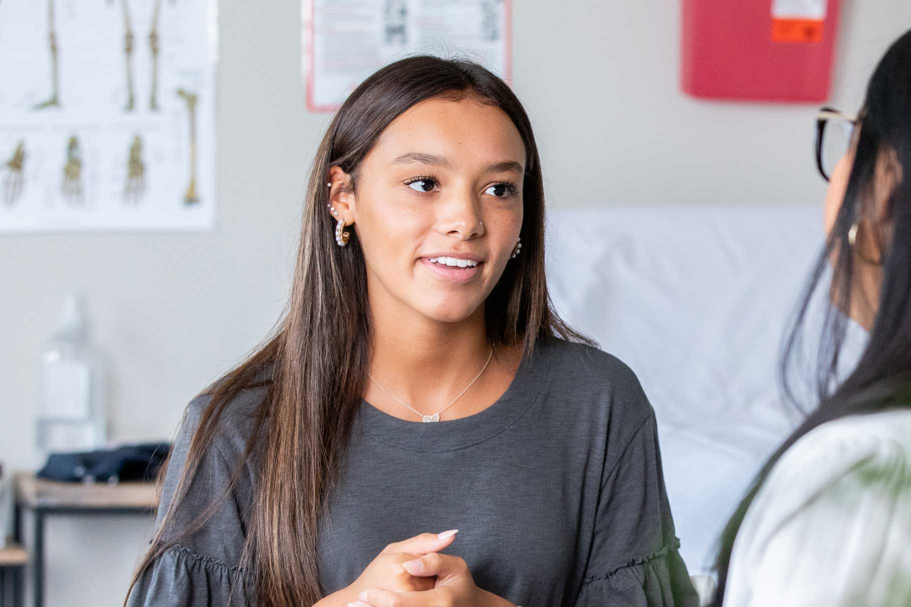 Young girl talking to a nurse