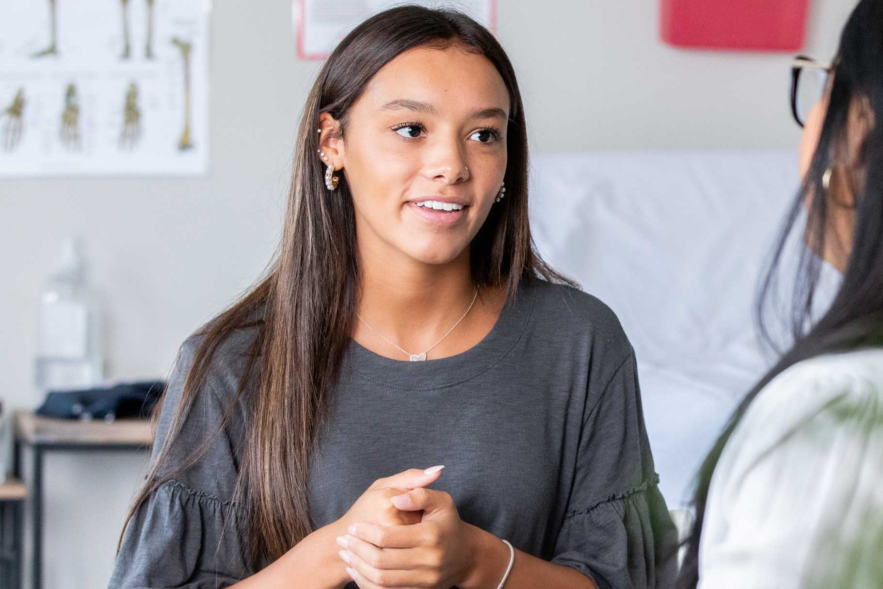 Young girl talking to a nurse